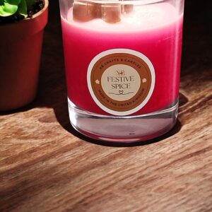 Festive Spice Christmas Candle with gingerbread scent in a clear glass jar